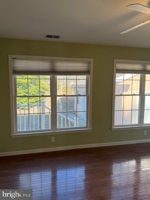 32841 East Riga Drive Ocean View, DE 19970 - Photo 28 of 33 a view of an empty room with wooden floor and a window