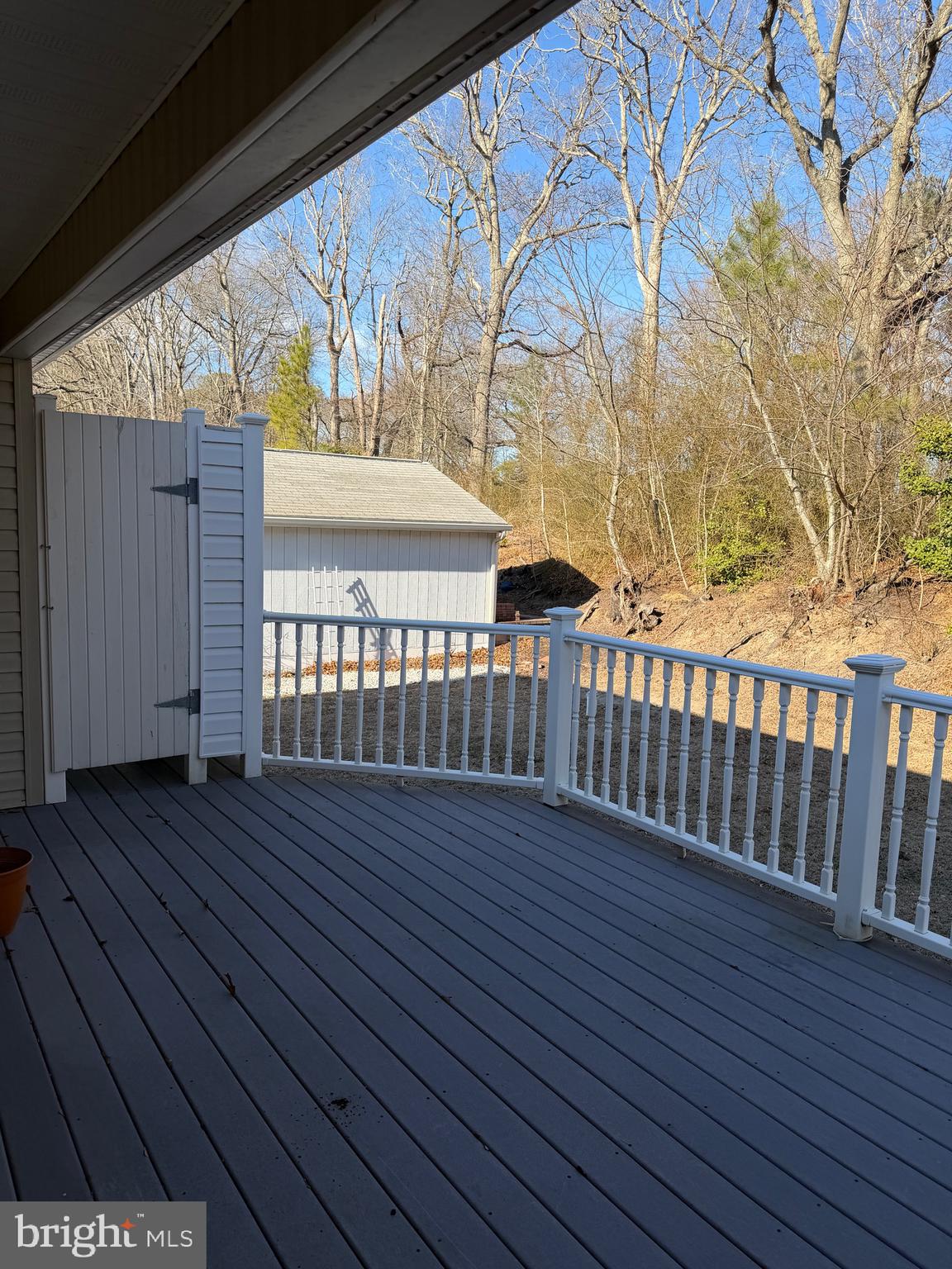 32841 East Riga Drive Ocean View, DE 19970 - Photo 32 of 33 a view of a porch with wooden floor and fence