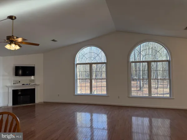 a view of kitchen and dining room with wooden floor