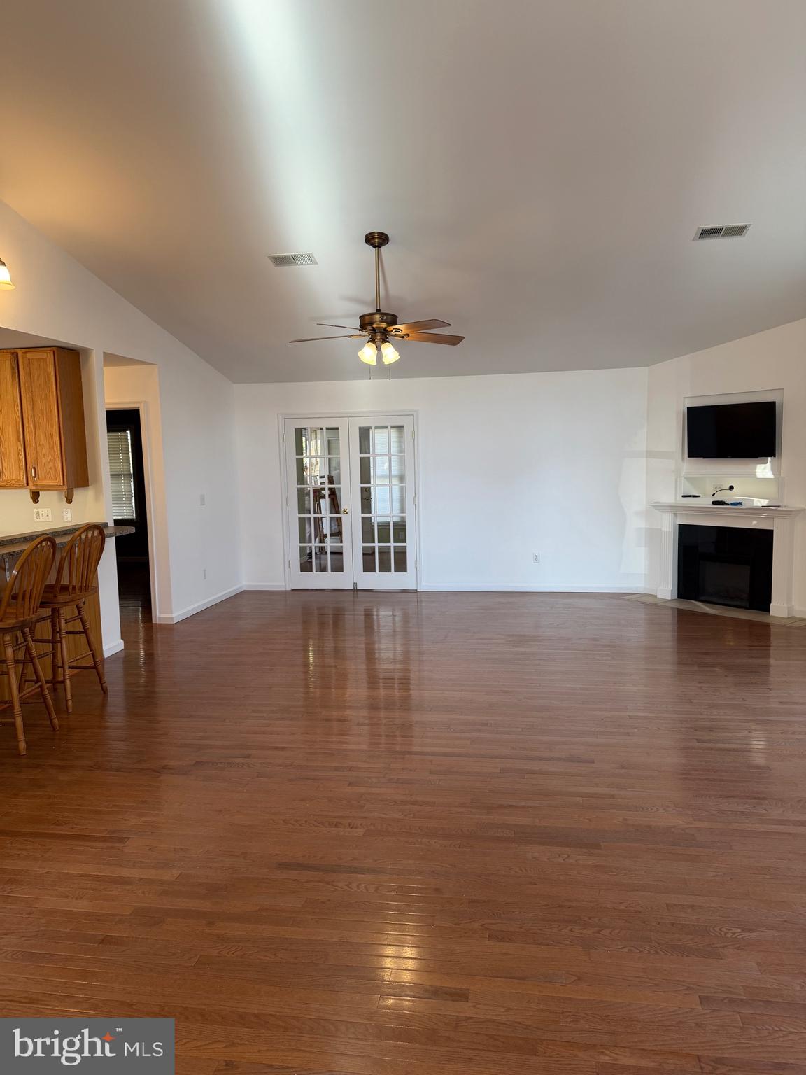 32841 East Riga Drive Ocean View, DE 19970 - Photo 5 of 33 a view of kitchen and dining room with wooden floor
