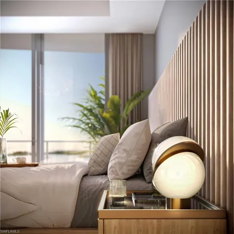 a living room with furniture and a mirror