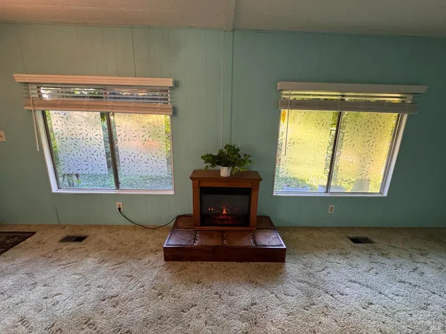 a room with a window and table