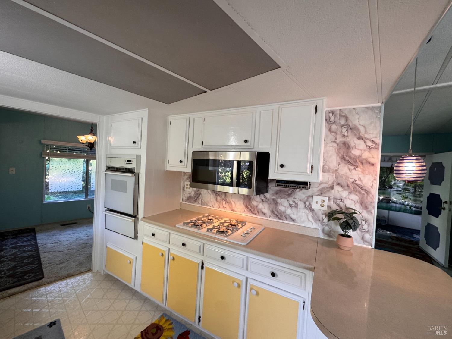 28 Springhill Court Santa Rosa, CA 95409 - Photo 13 of 36 a kitchen with stainless steel appliances kitchen island granite countertop a stove a sink and a refrigerator