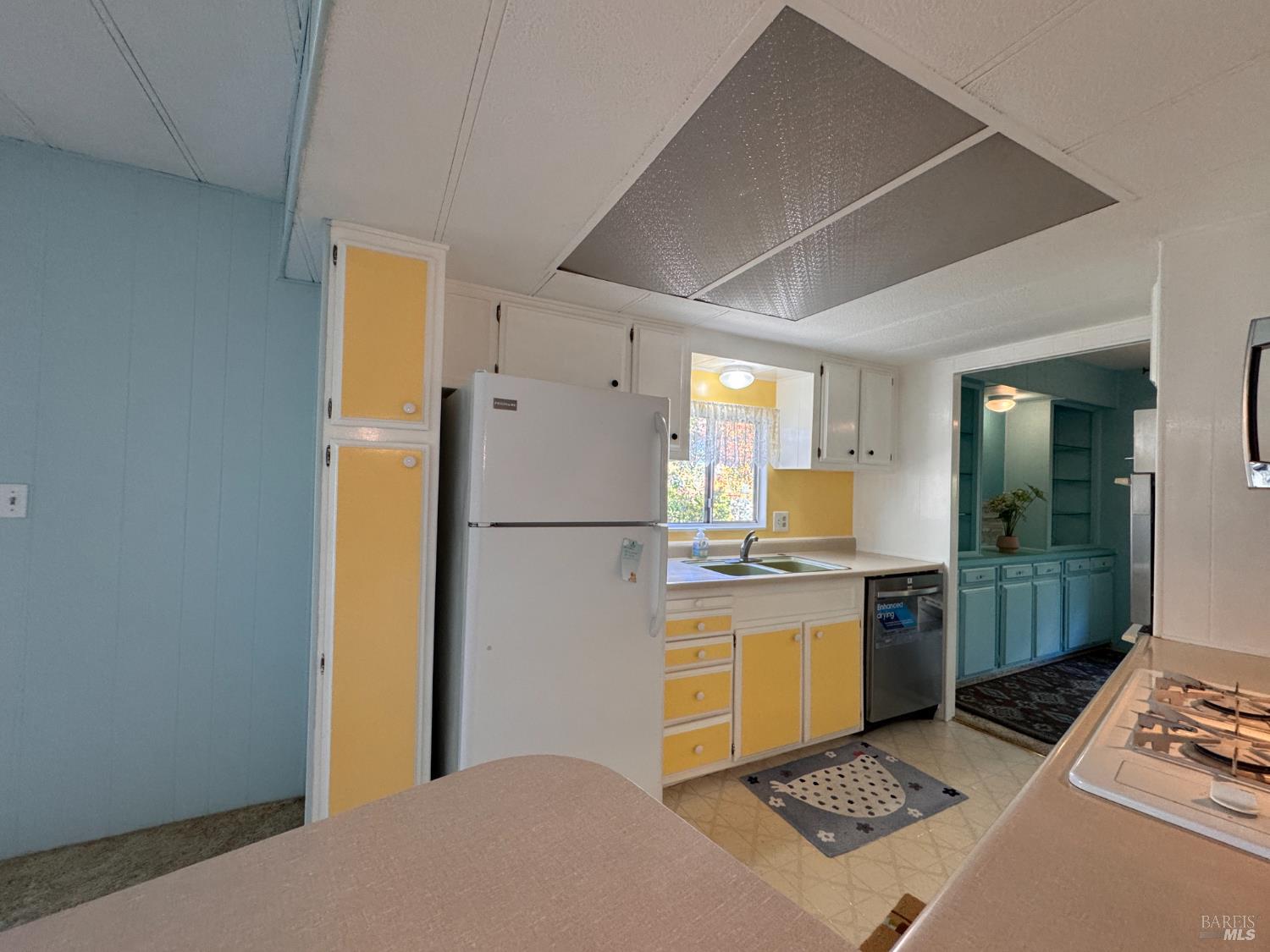 28 Springhill Court Santa Rosa, CA 95409 - Photo 16 of 36 a kitchen with a stove a refrigerator and a stove top oven