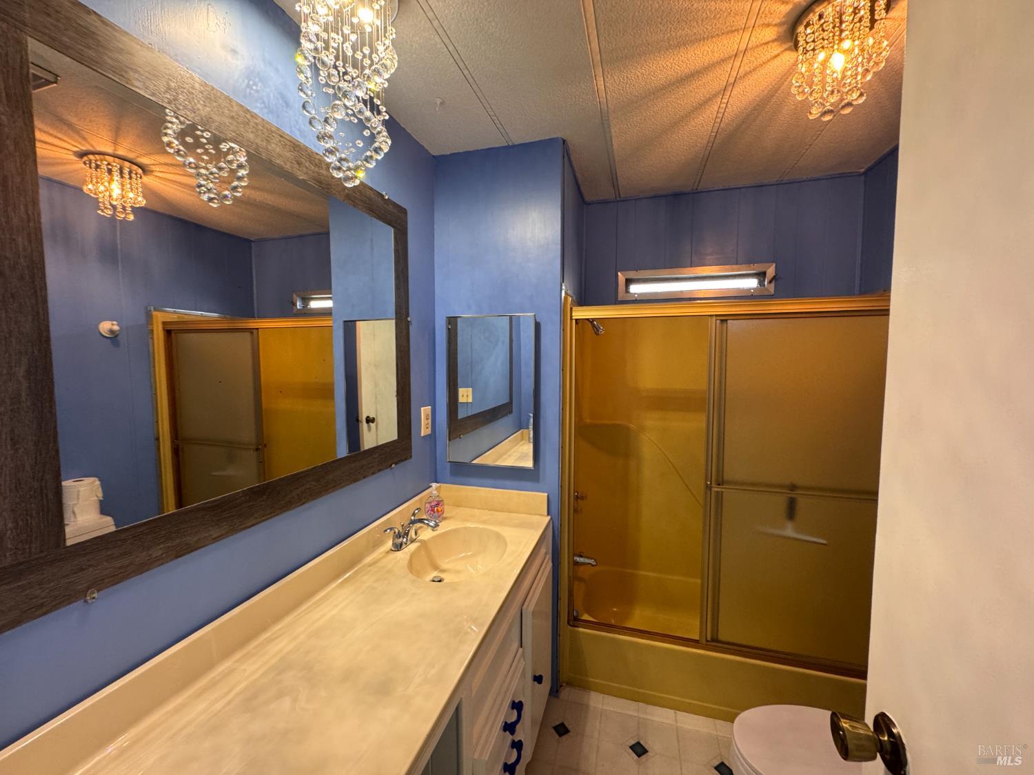 28 Springhill Court Santa Rosa, CA 95409 - Photo 27 of 36 a bathroom with a sink and mirror