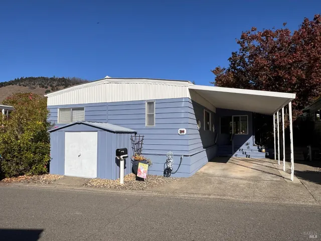 a view of balcony with wooden floor and fence