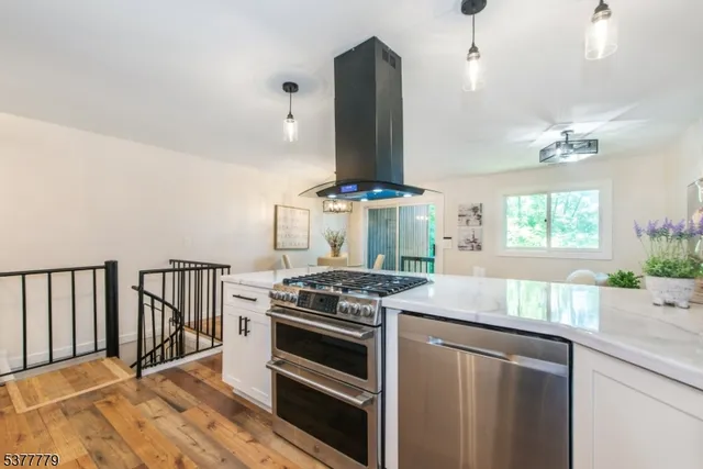 a kitchen with granite countertop a stove and a sink