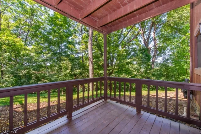 a view of balcony with wooden floor