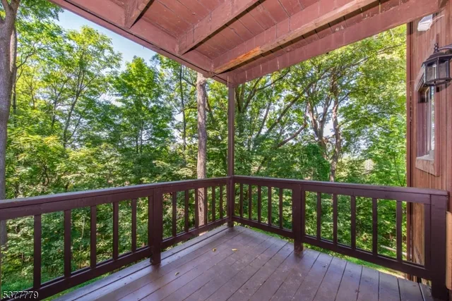 a view of a balcony with wooden floor