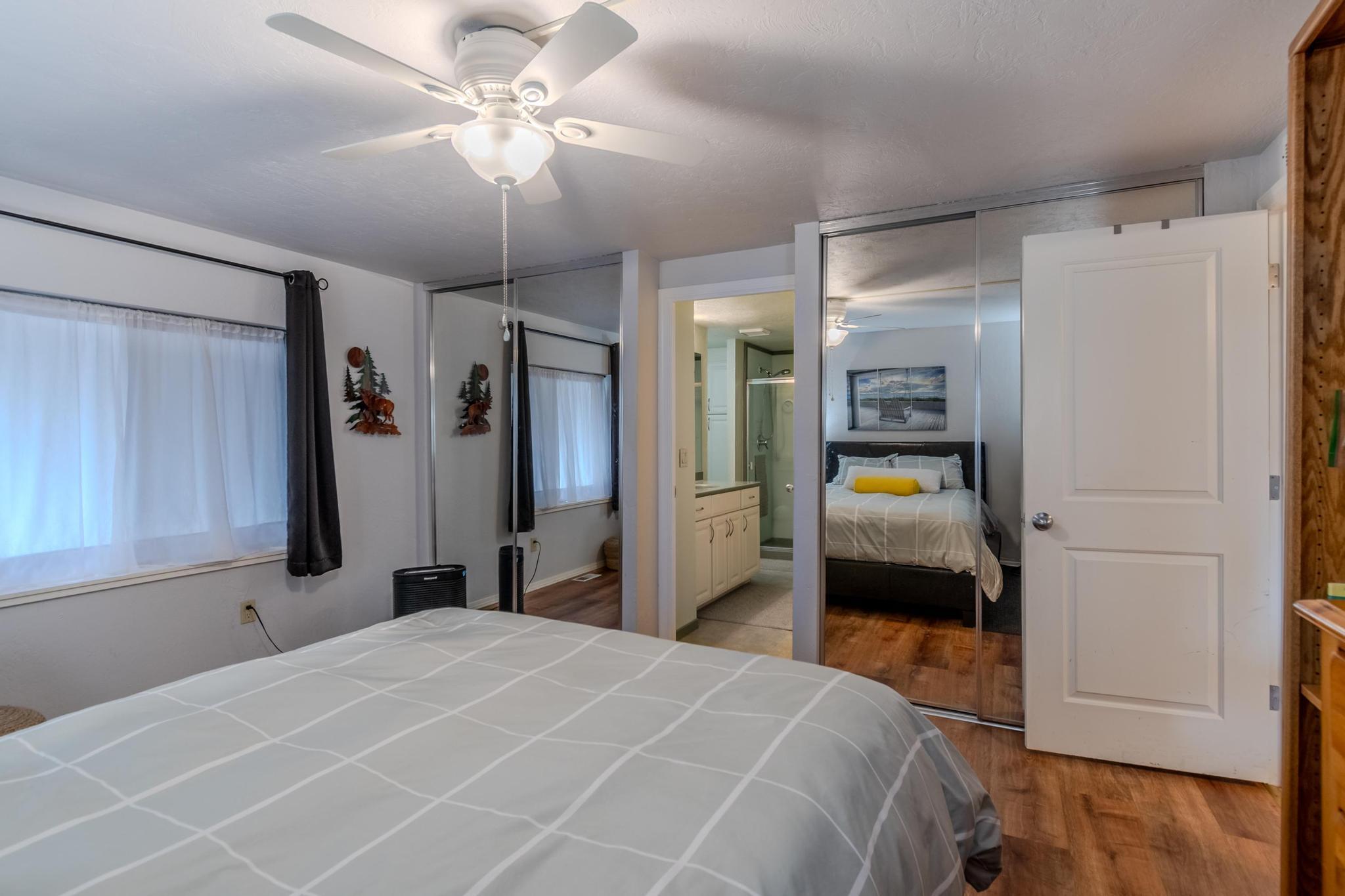 215 Tolman Creek Road, Unit SPC 11 Ashland, OR 97520 - Photo 15 of 36 a bedroom with a bed and a chandelier