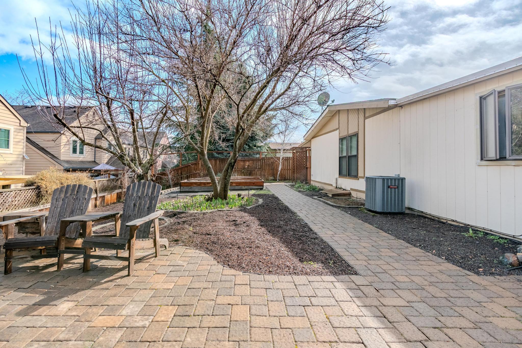 215 Tolman Creek Road, Unit SPC 11 Ashland, OR 97520 - Photo 25 of 36 a backyard of a house with barbeque oven
