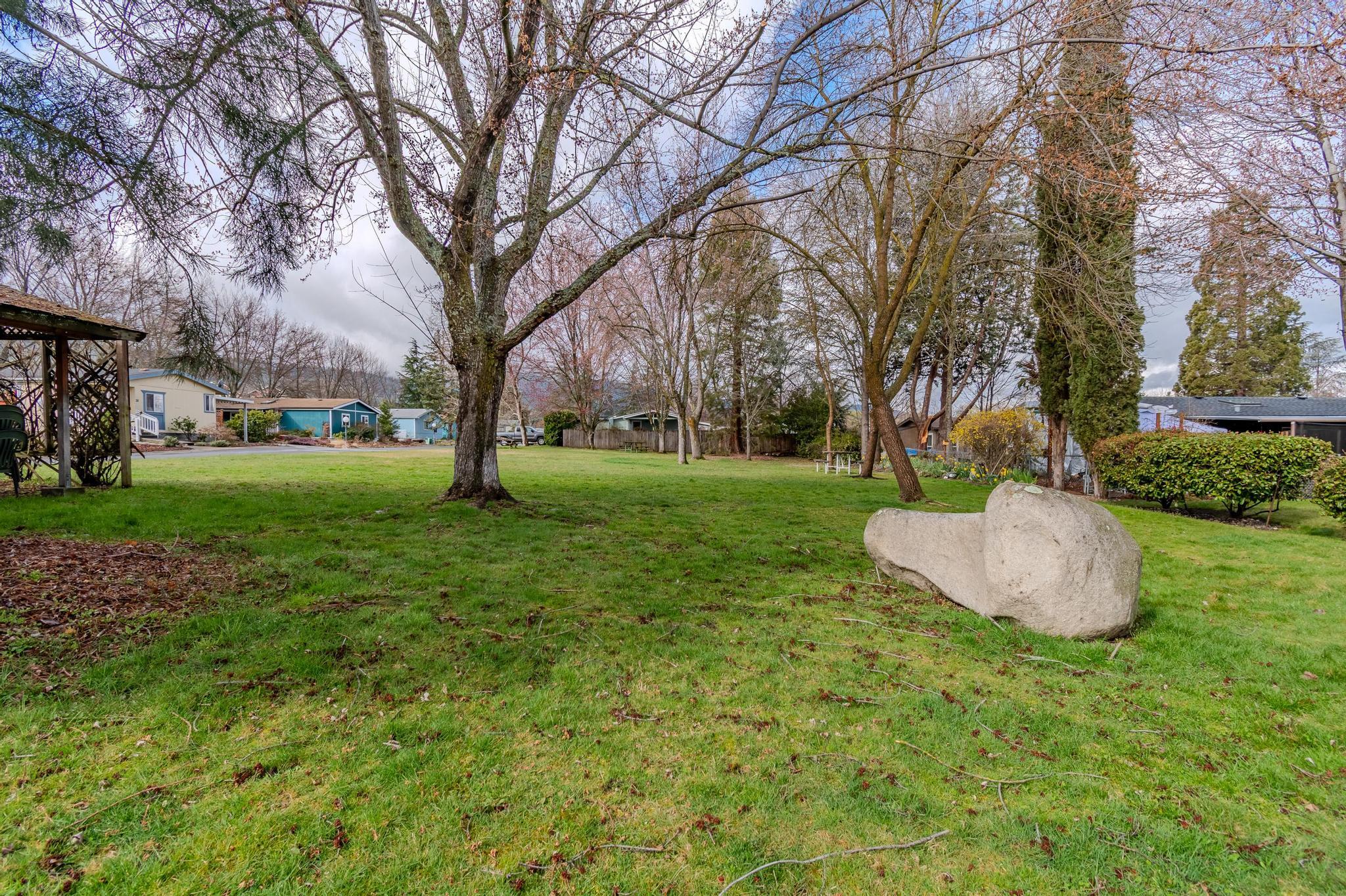 215 Tolman Creek Road, Unit SPC 11 Ashland, OR 97520 - Photo 36 of 36 a view of a garden with trees