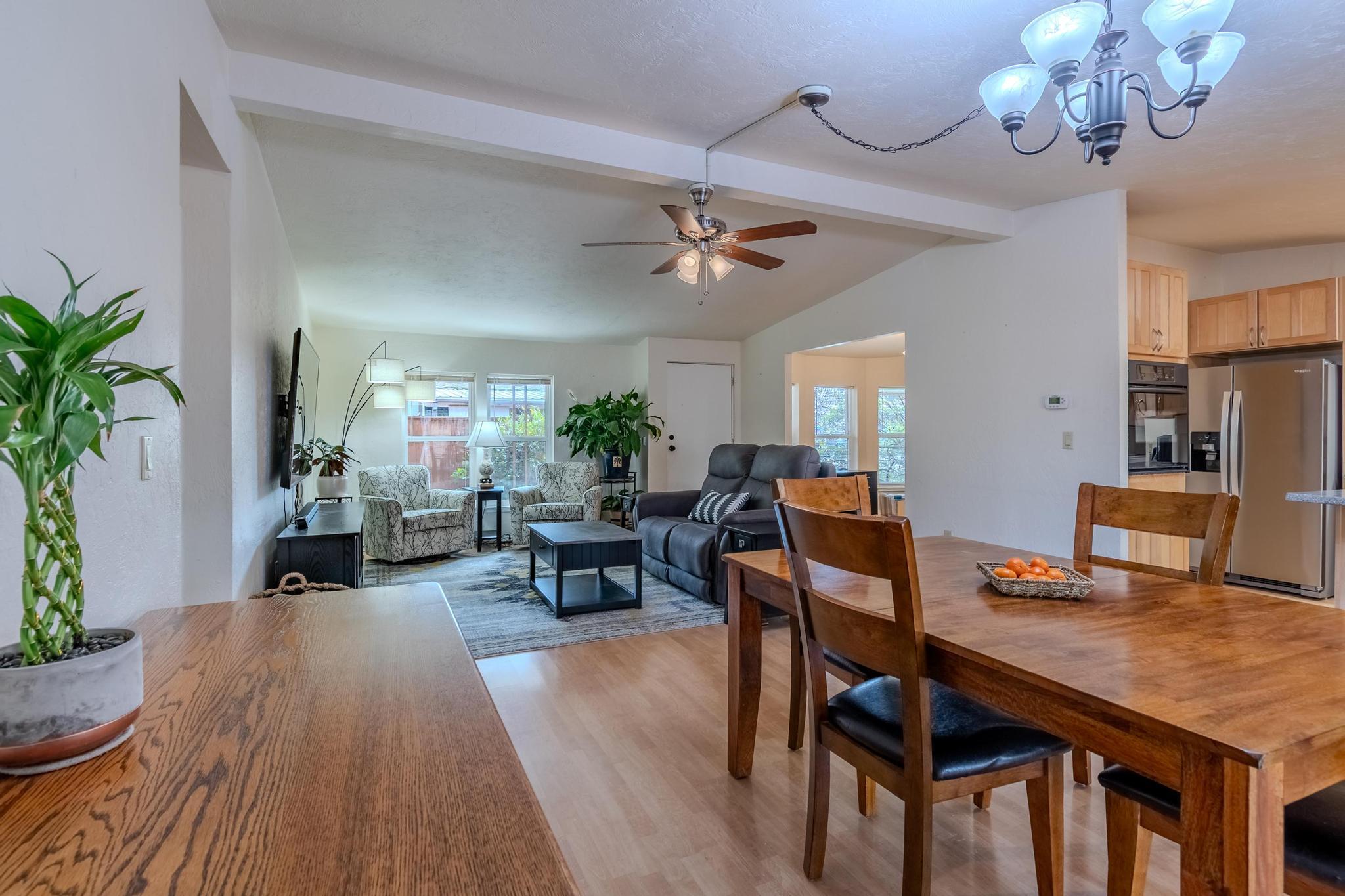 215 Tolman Creek Road, Unit SPC 11 Ashland, OR 97520 - Photo 6 of 36 a view of a dining room with furniture window and wooden floor