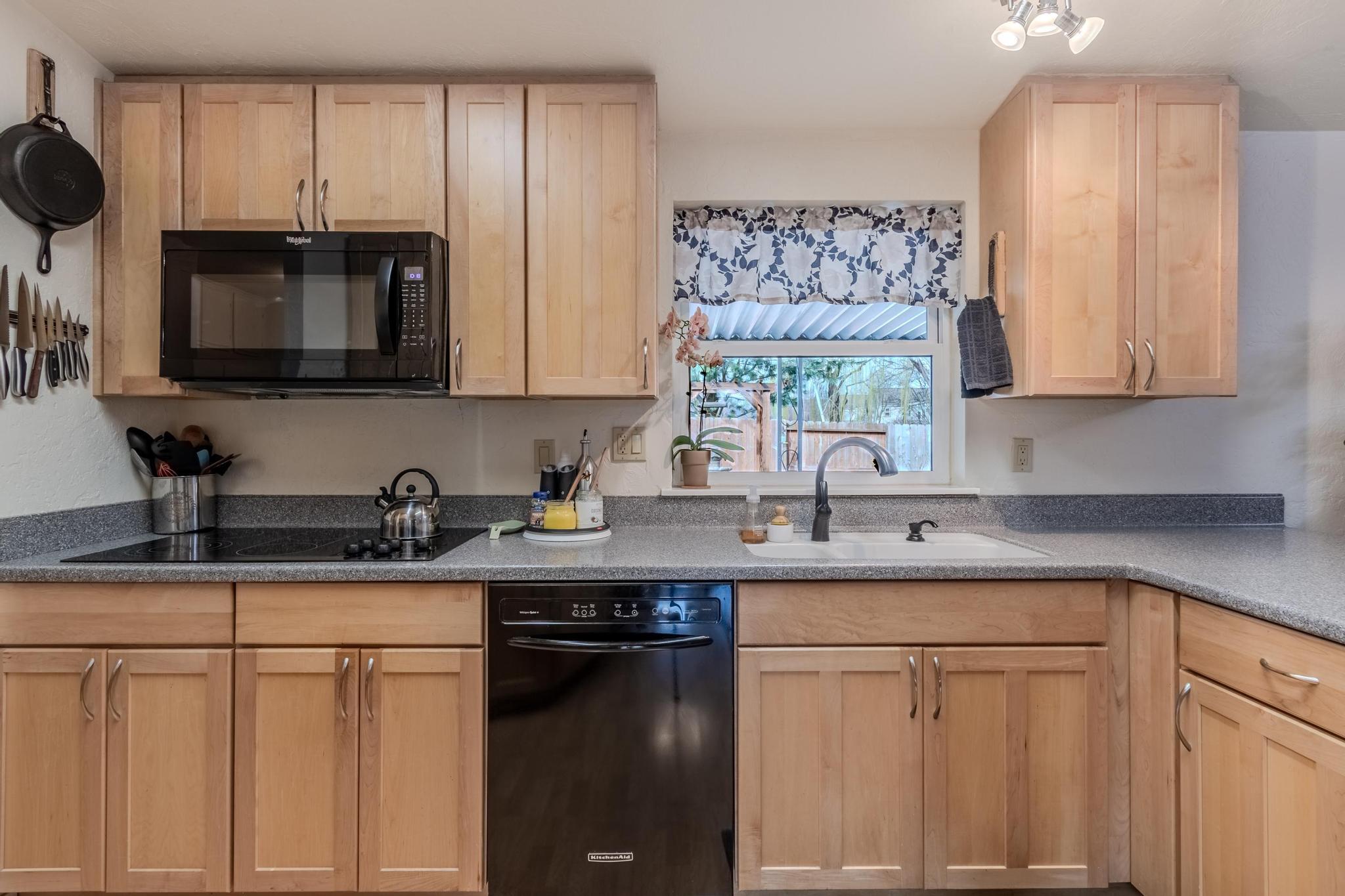 215 Tolman Creek Road, Unit SPC 11 Ashland, OR 97520 - Photo 9 of 36 a kitchen with stainless steel appliances granite countertop a sink stove and microwave