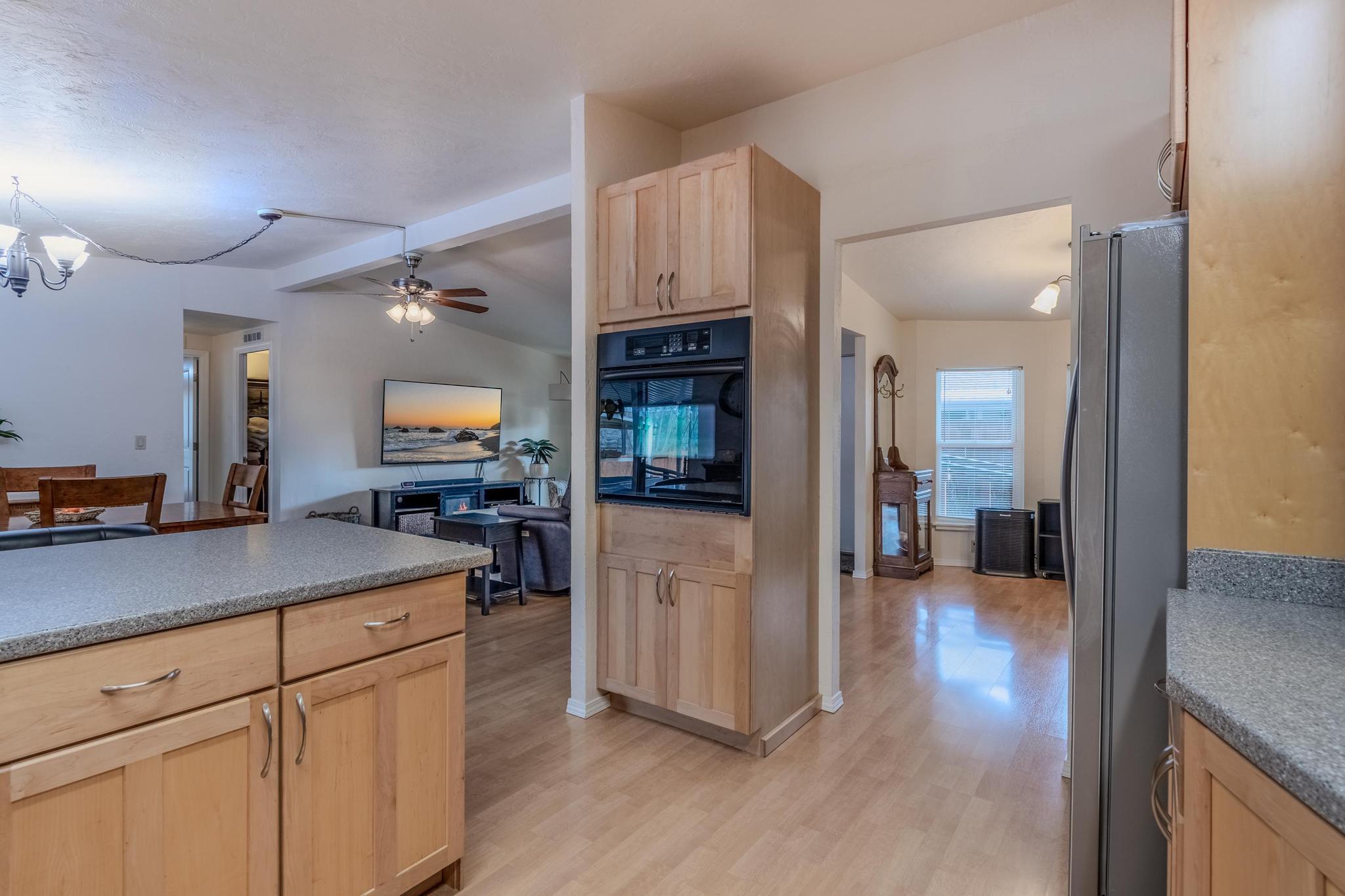 215 Tolman Creek Road, Unit SPC 11 Ashland, OR 97520 - Photo 10 of 36 a view of a kitchen cabinets and wooden floor