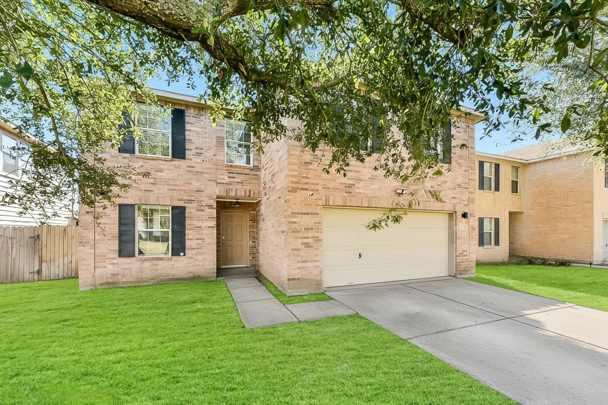 20011 Spring Wreath Lane Cypress, TX 77433 - Photo 3 of 39 a view of a house with a yard