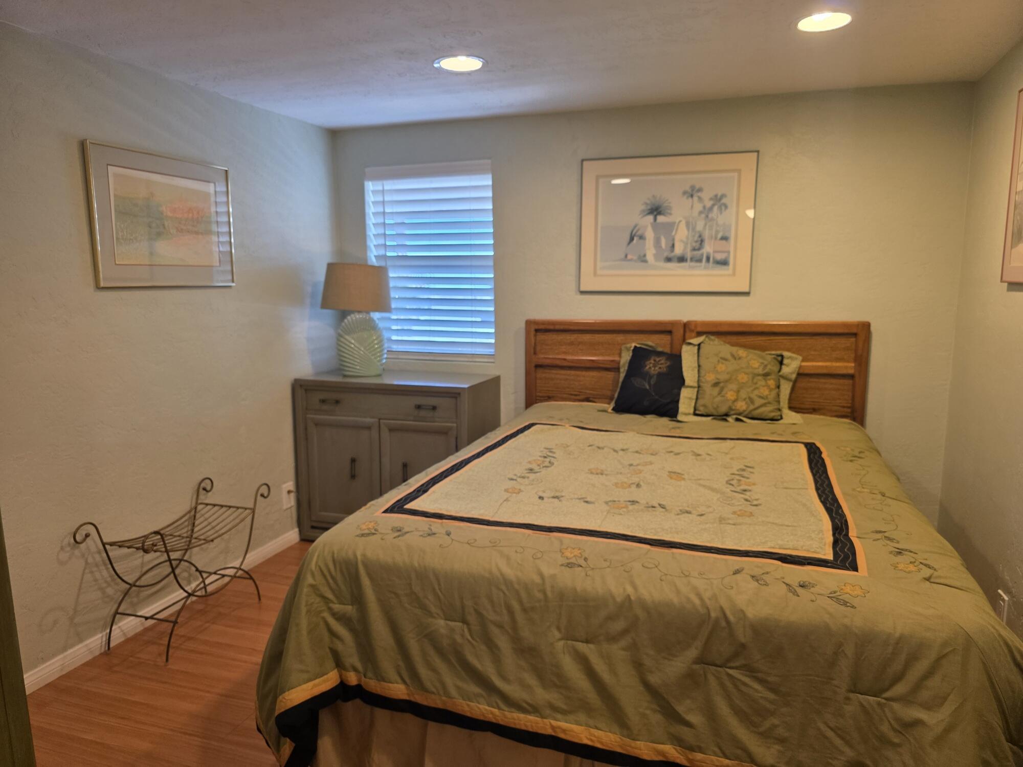 10595 Hot Mineral Spa Road, Unit 235 Niland, CA 92257 - Photo 15 of 45 a bedroom with a bed and painting on the wall