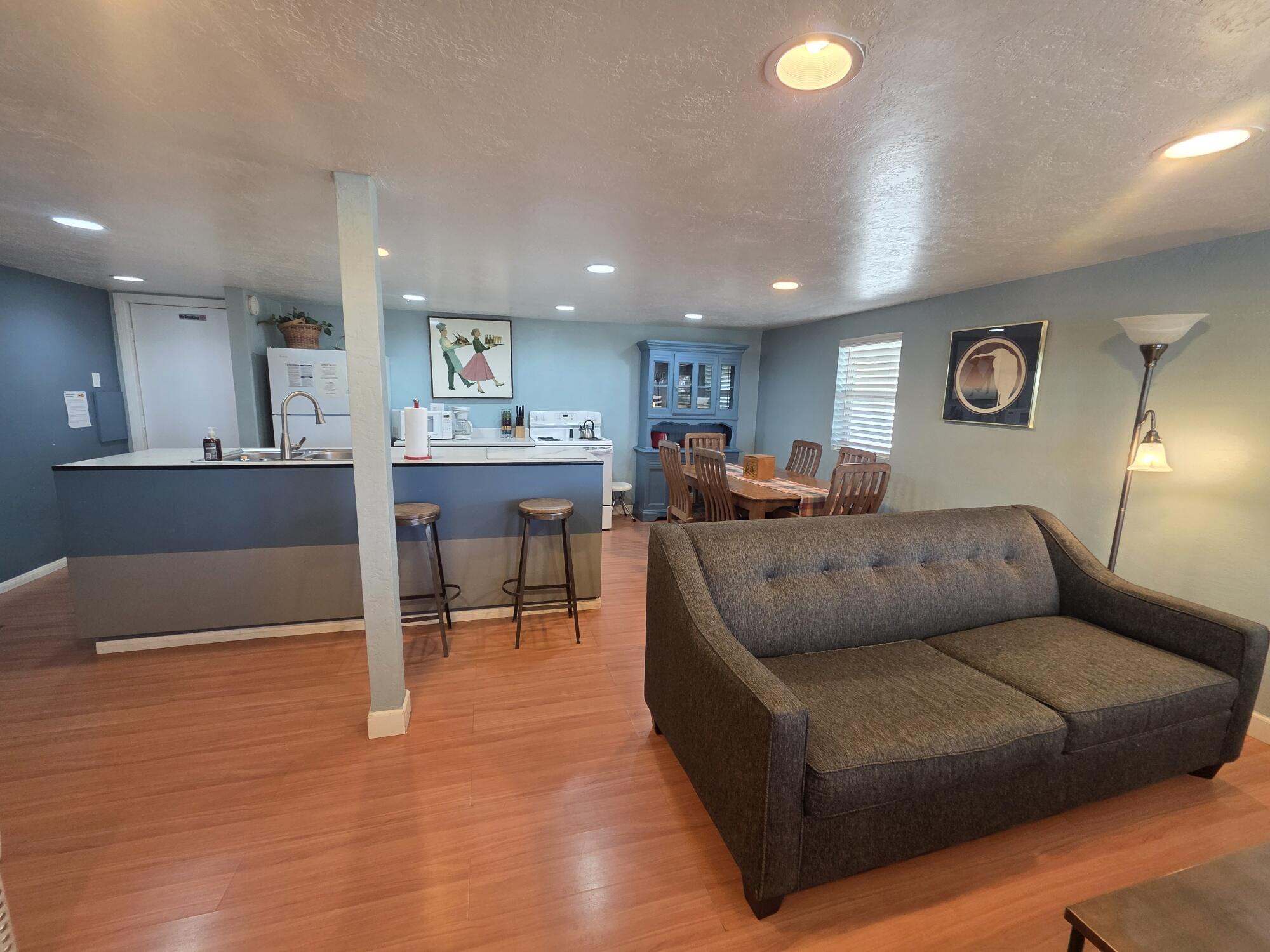 10595 Hot Mineral Spa Road, Unit 235 Niland, CA 92257 - Photo 7 of 45 a living room with furniture and a dining table with kitchen view