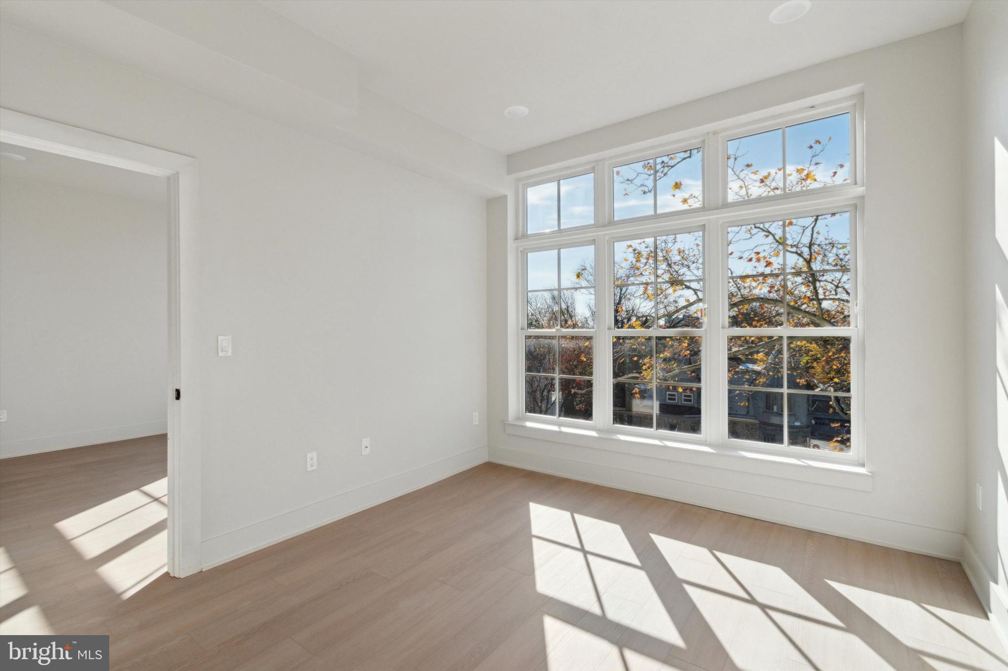 5521 Wayne Avenue, Unit 305 Philadelphia, PA 19144 - Photo 5 of 11 a view of an empty room with a window