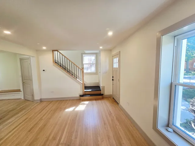 a view of entryway with wooden floor