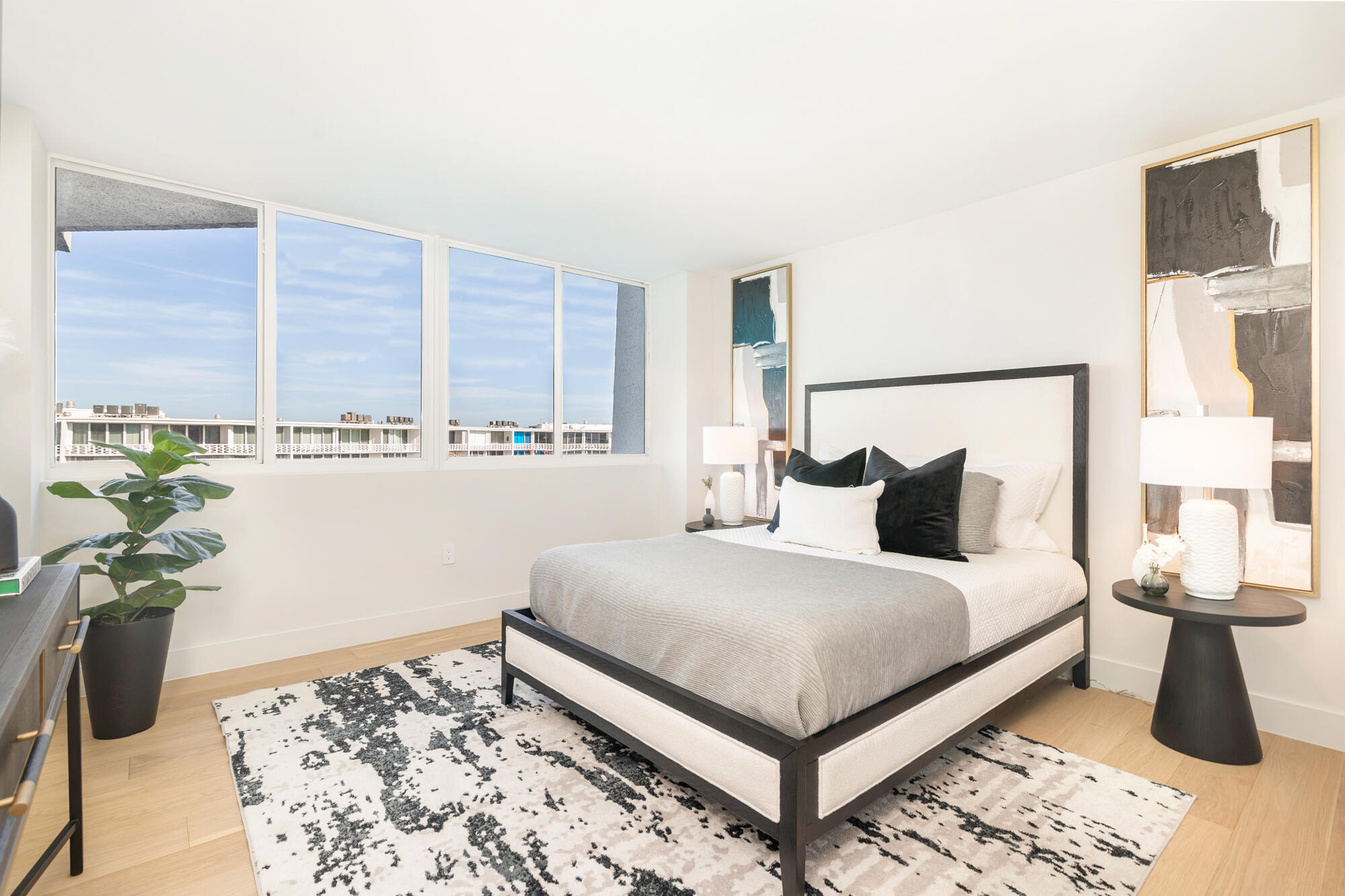 2773 South Ocean Boulevard, Unit 505 Palm Beach, FL 33480 - Photo 14 of 32 a bedroom with a bed lamp and a potted plant