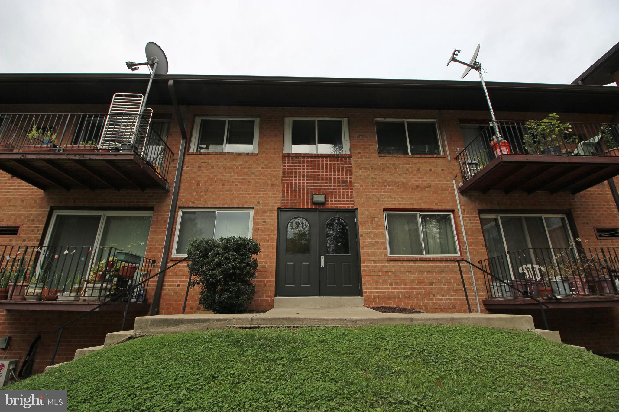 17 Water Street, Unit 22 Gaithersburg, MD 20877 - Photo 1 of 9 a front view of a house with a yard
