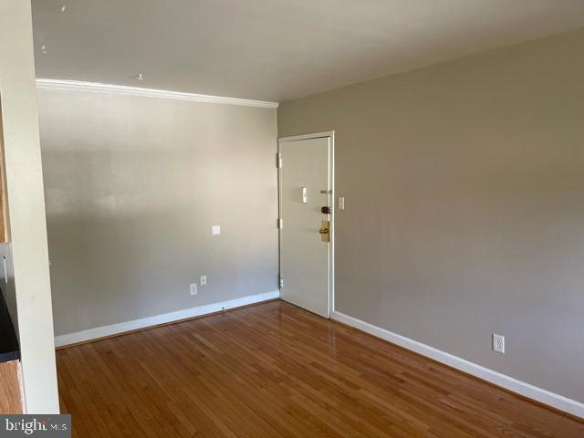 17 Water Street, Unit 22 Gaithersburg, MD 20877 - Photo 2 of 9 a view of an empty room with wooden floor