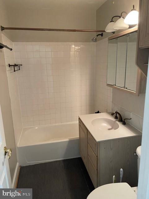 17 Water Street, Unit 22 Gaithersburg, MD 20877 - Photo 8 of 9 a bathroom with a sink a toilet and shower