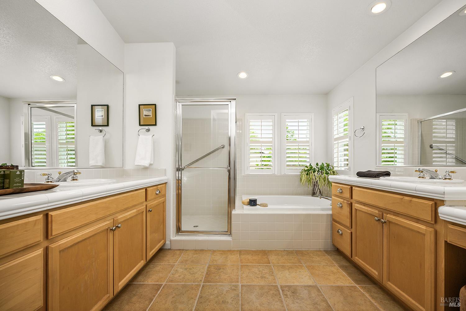 38 Maybeck Street Novato, CA 94949 - Photo 32 of 47 a bathroom with a tub sink shower and mirror