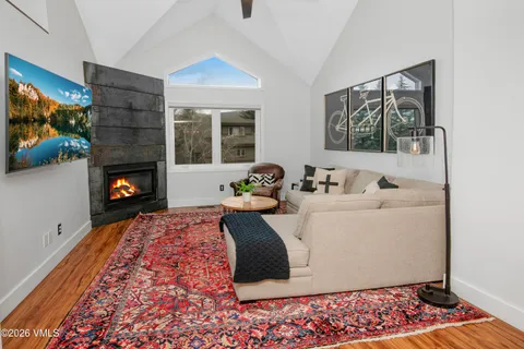 a living room with furniture and a rug