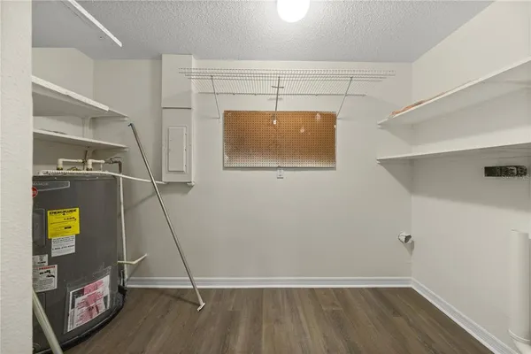 a view of room with wooden floor