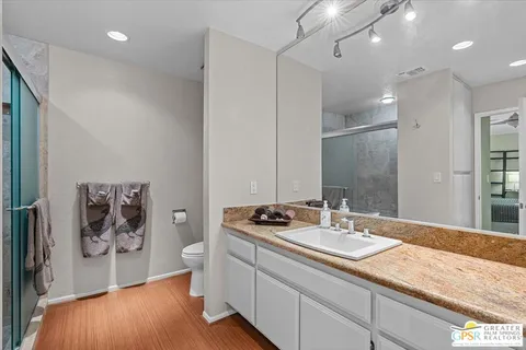 a bathroom with a sink a vanity and a mirror
