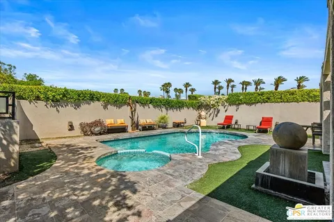 a view of a table and chairs in the garden