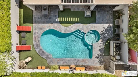 an aerial view of a house with a garden