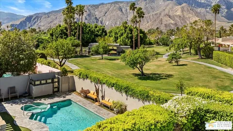 a view of yard with swimming pool