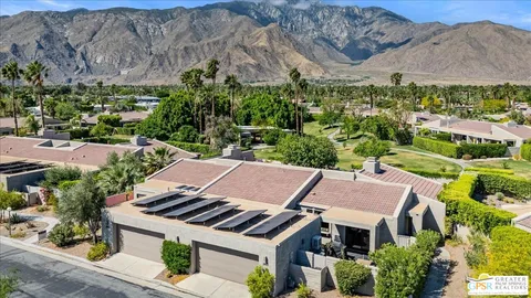 an aerial view of a house with a garden
