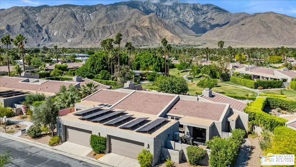 an aerial view of a house with a garden