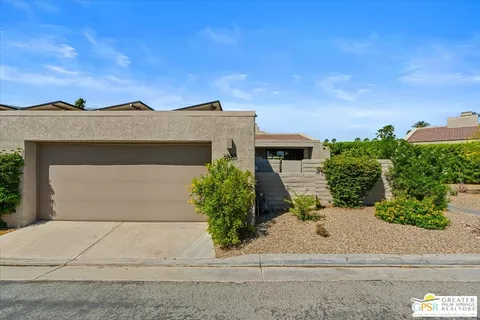 front view of a house with a street