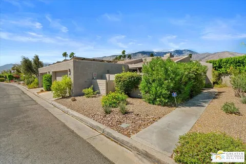 front view of a house with a street view