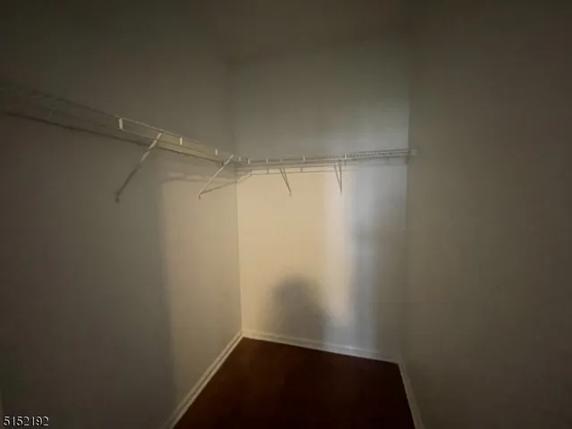 a view of a swimming pool with chairs