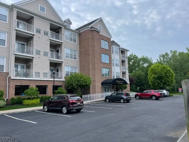 a view of a patio with table and chairs with wooden floor and plants