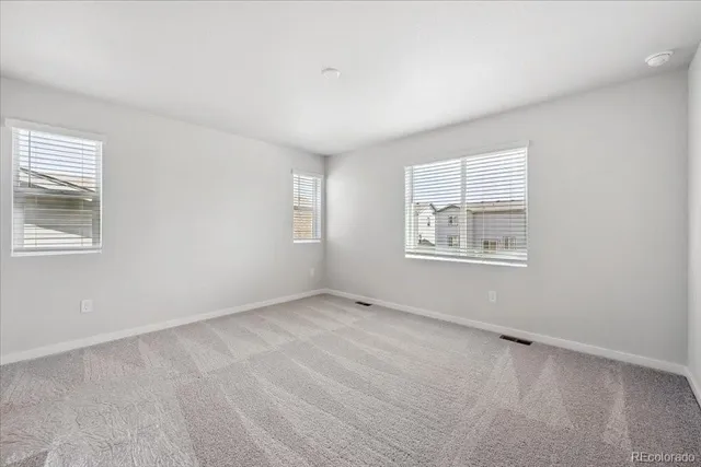 a spacious bathroom with a double vanity sink double and mirror