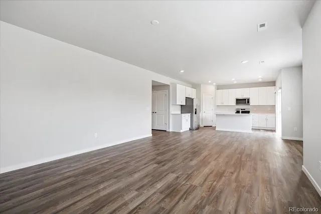 a view of kitchen with wooden floor
