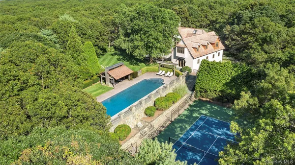 an aerial view of a house with a garden