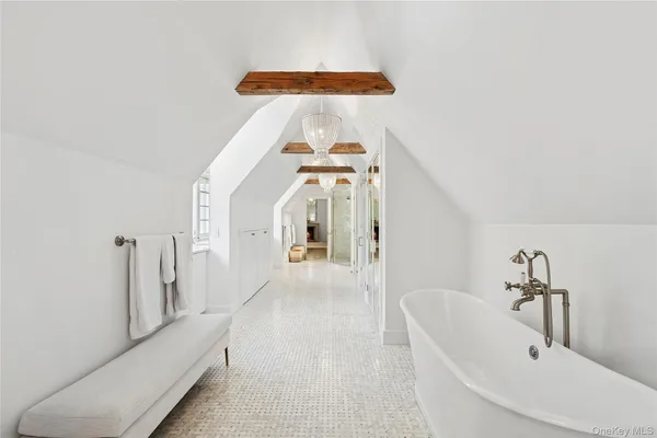 a en suite bathroom with a bathtub and window
