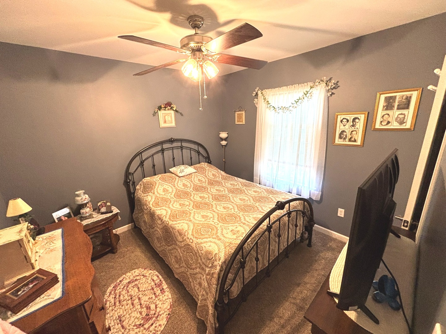 440 North Indiana Avenue Salem, IL 62881 - Photo 9 of 15 a bedroom with a bed and a chandelier