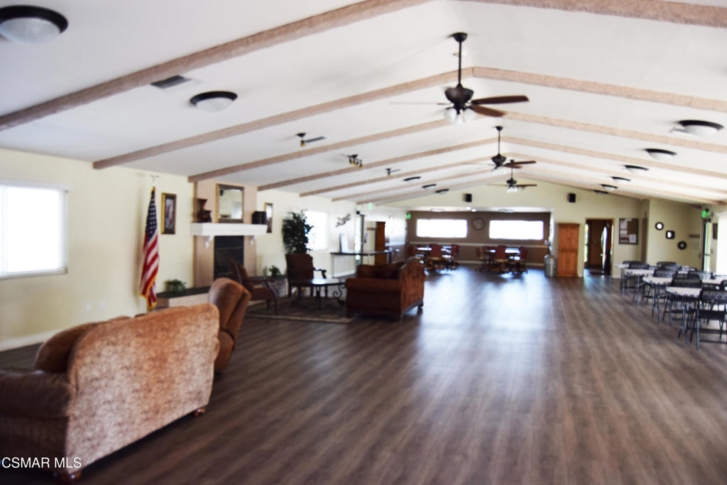 195 Tierra Rejada Road, Unit 197 Simi Valley, CA 93065 - Photo 26 of 28 a living room with furniture and a wooden floor