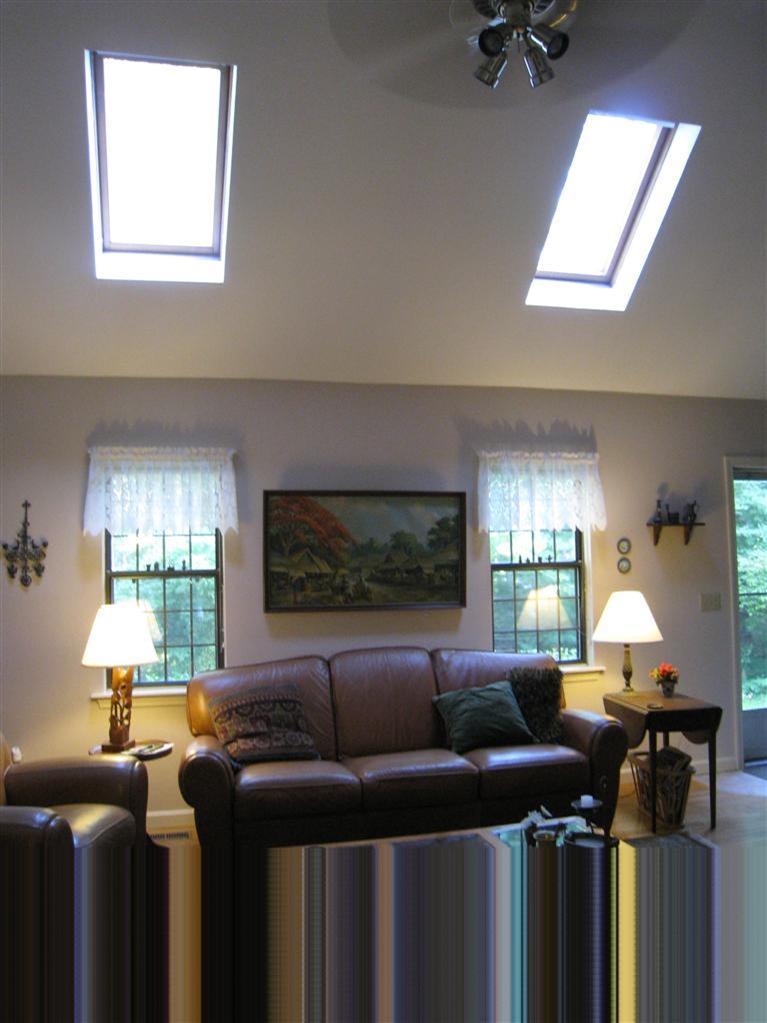 105 Nobadeer Road Centerville, MA 02632 - Photo 5 of 22 a living room with furniture a window and a flat screen tv