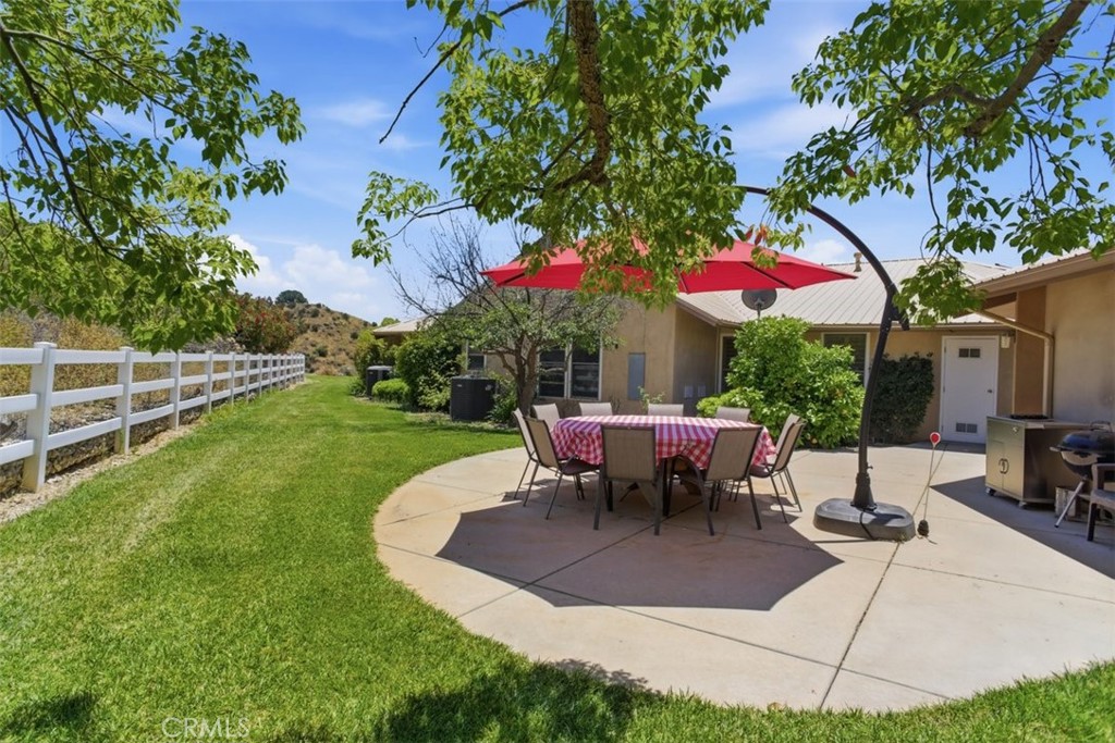 31233 Romero Canyon Road Castaic, CA 91384 - Photo 5 of 38 a view of a tables and chairs in a yard