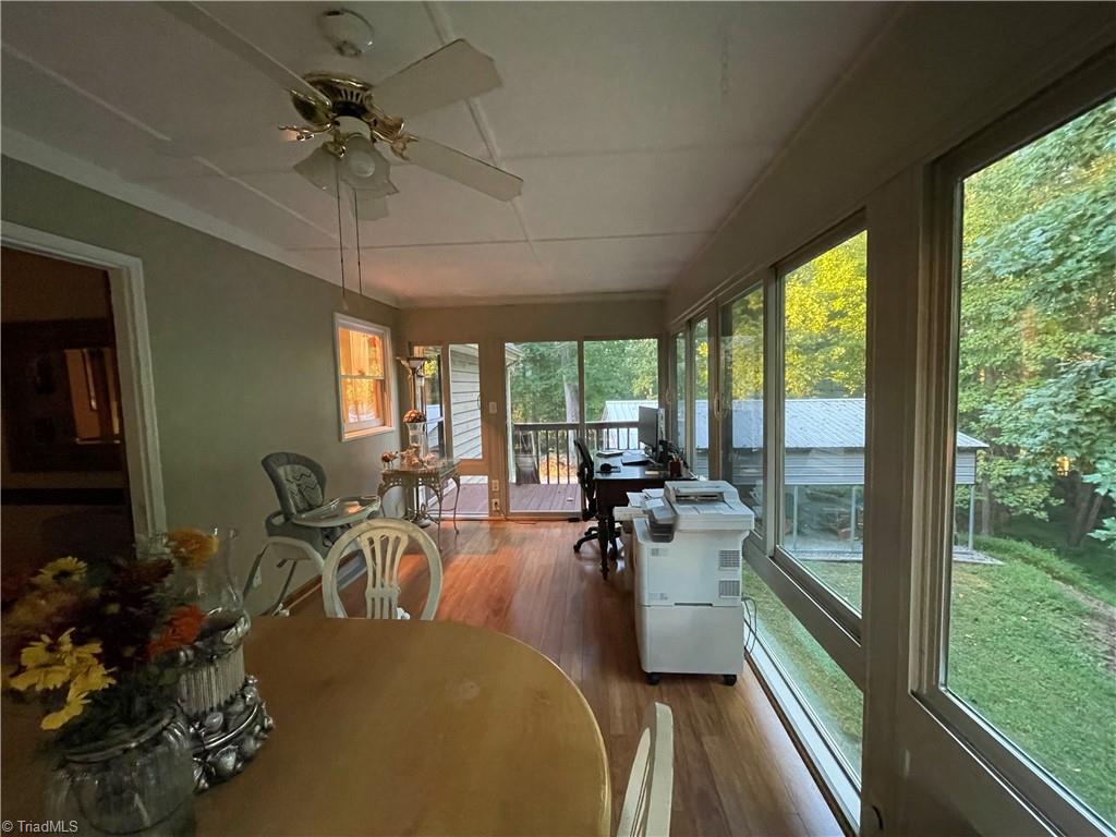 7756 Robinson Road Summerfield, NC 27358 - Photo 26 of 31 Sun Room toward Deck 2